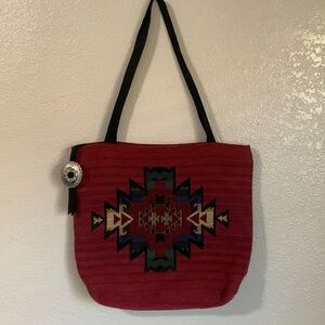 Aztec print tapestry tote with matching pouch.
